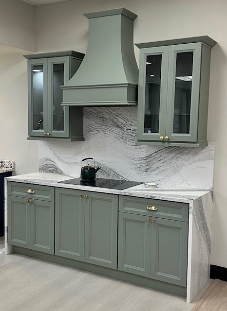 Custom cabinetry display in sage green